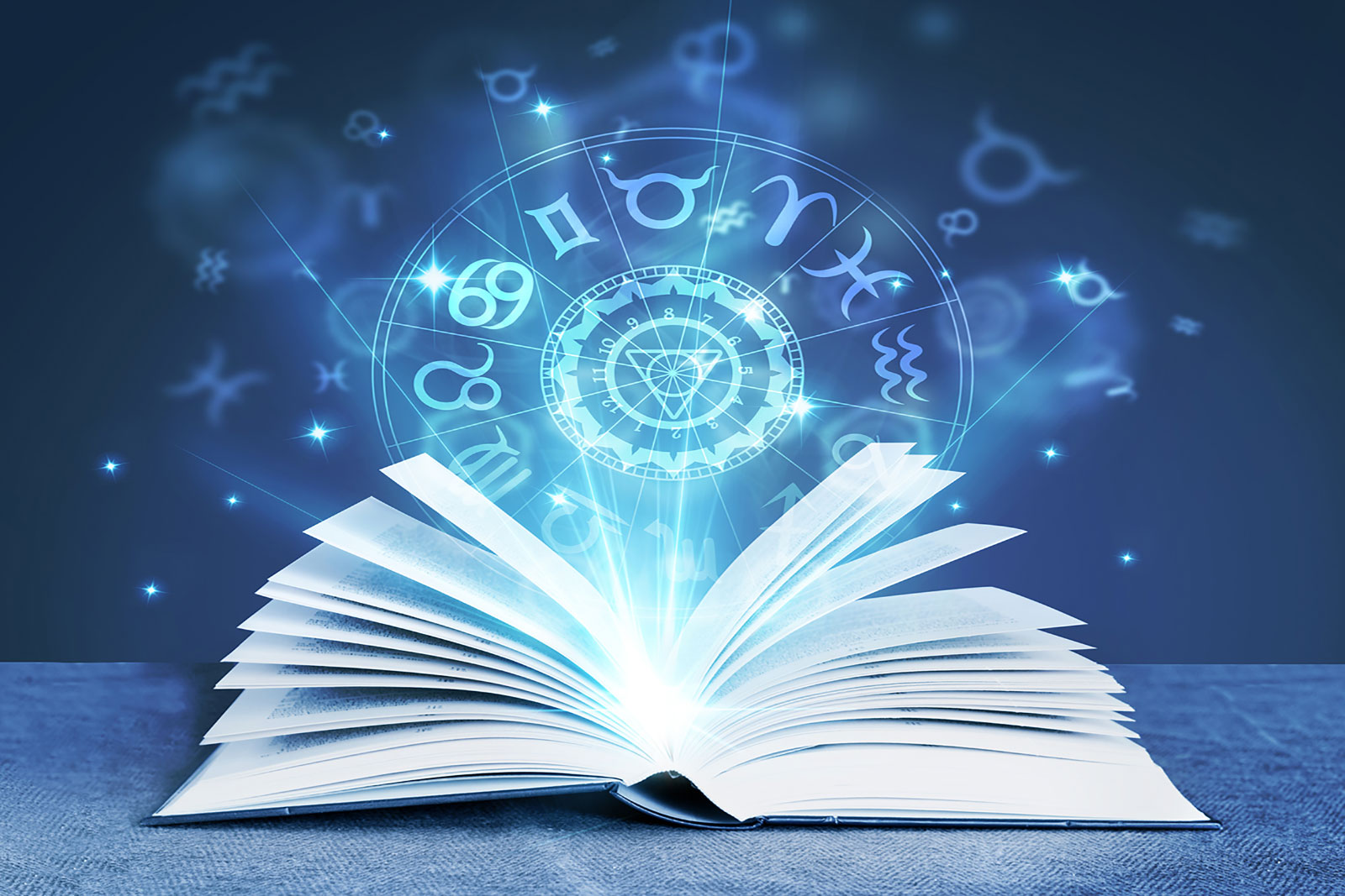 Open book with a glowing zodiac wheel and astrological symbols representing astrology and spiritual guidance.